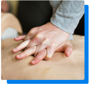 Person performing CPR on training manikin